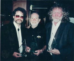 Robert MacDonald, Jr., Willie Nelson, Grant Boatwright with awards for Peace In The Valley